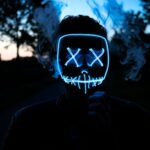 man in black and white star mask